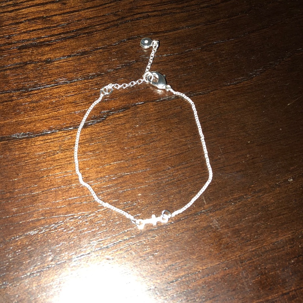 Lauren Conrad cross bracelet
